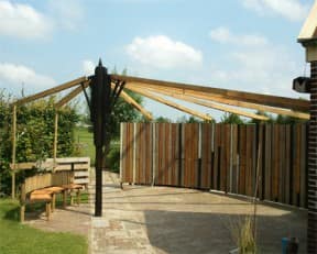 Garden with umbrella made from renovation leftovers