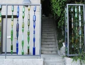 Garden fence with recycled bottles