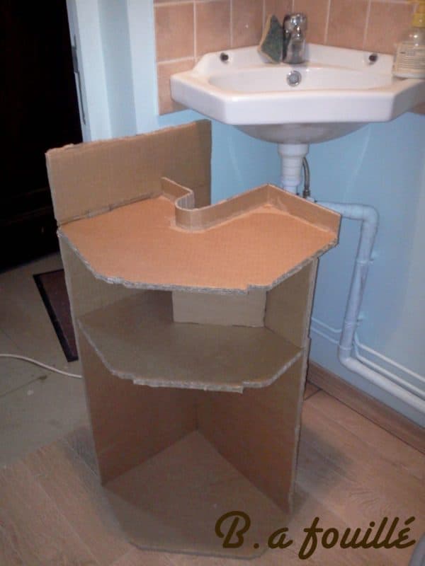 Upcycled Cardboard around a Siphon as Bathroom Furniture 3 • Recycled Cardboard • Recyclart recyclart.org-cardboard-around-a-siphon2