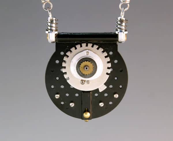 This piece of Camera Jewelry is made from a gear set.