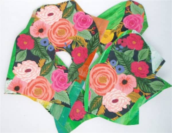 I cut out sections of the wrapping paper and used ModPodge as the adhesive and sealant for the Gift Wrap Wreath.