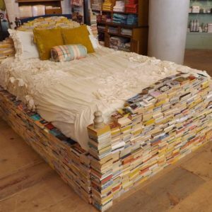 bedframe of paperback books